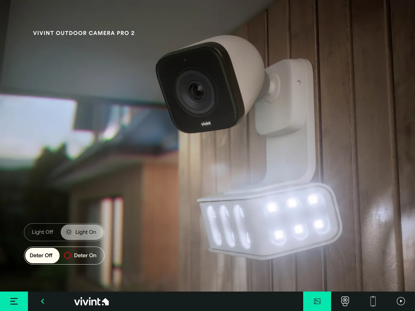 Outdoor Camera Pro 2 slide: the camera and floodlight on a timber wall, lit, with light and deter toggles.